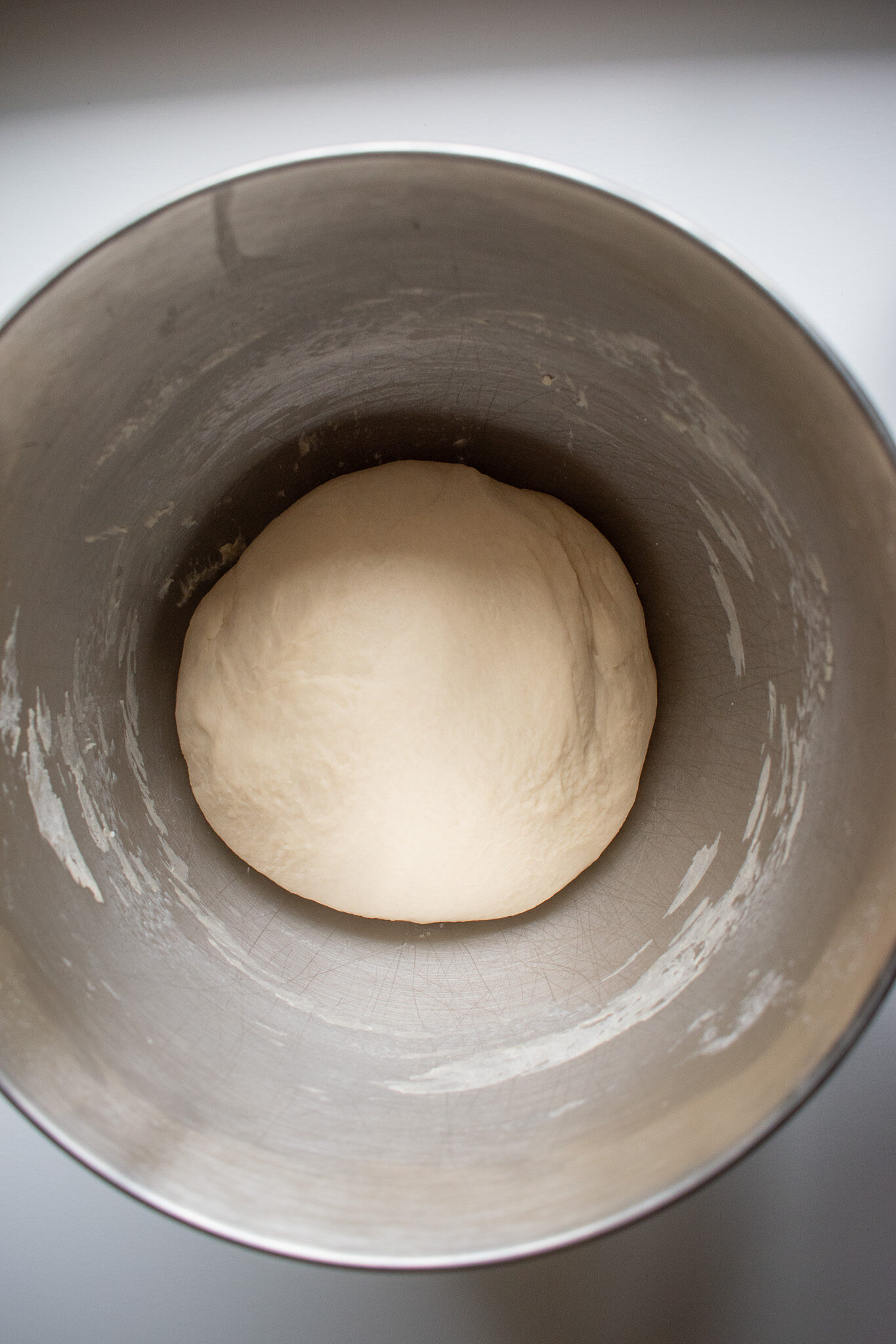 Overnight sourdough sandwich bread in a mixing bowl before proofing.