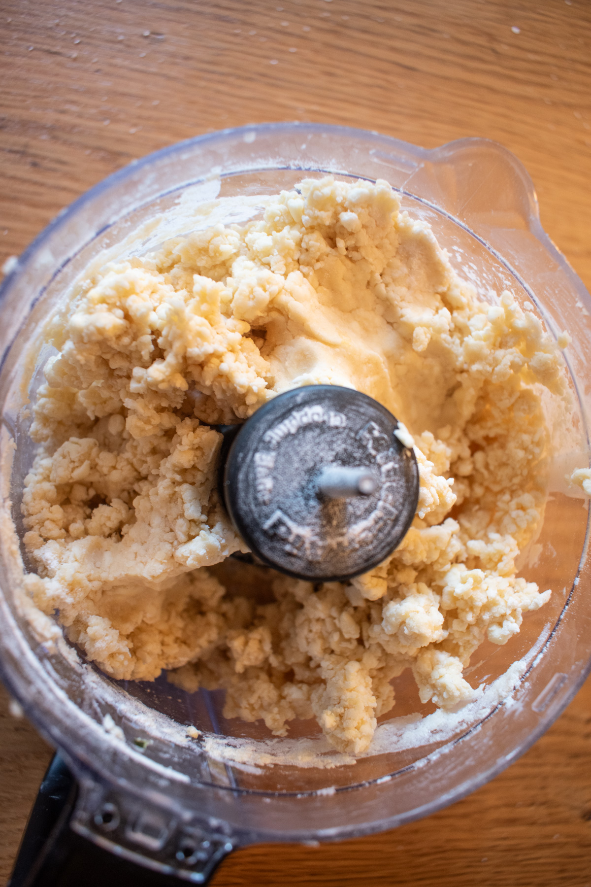 Pie crust dough in a food processor for sourdough discard pie crust.