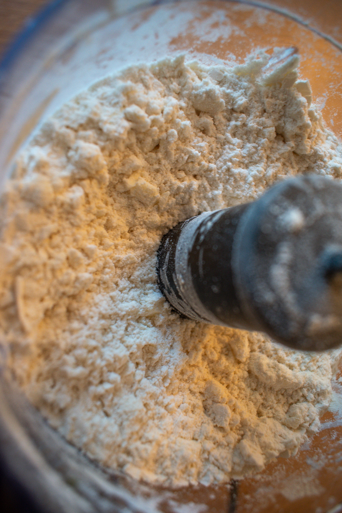 Butter cut into flour in a food processor for sourdough discard pie crust.