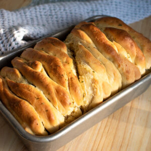 Picture of sourdough discard pull-apart bread in a loaf pan.