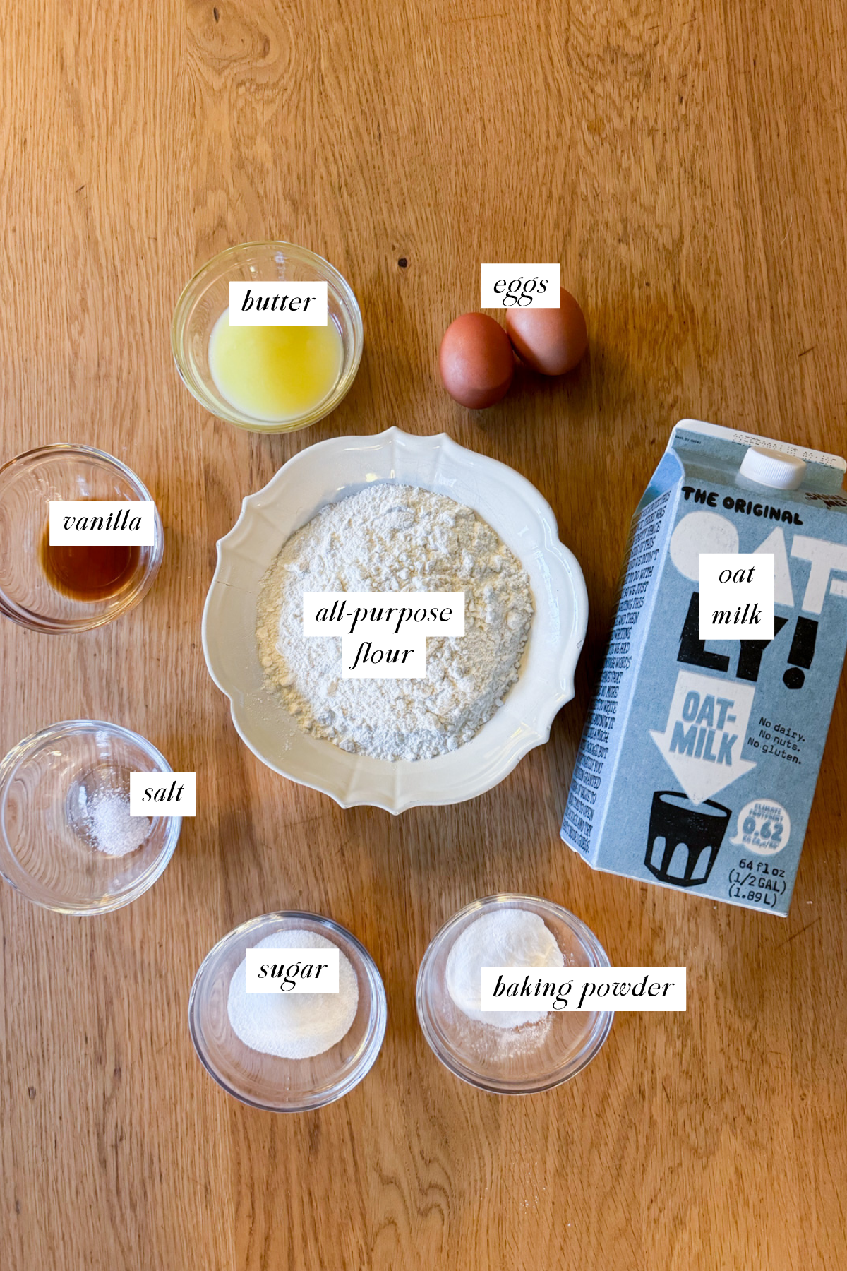 The ingredients needed for oat milk pancakes with labels.