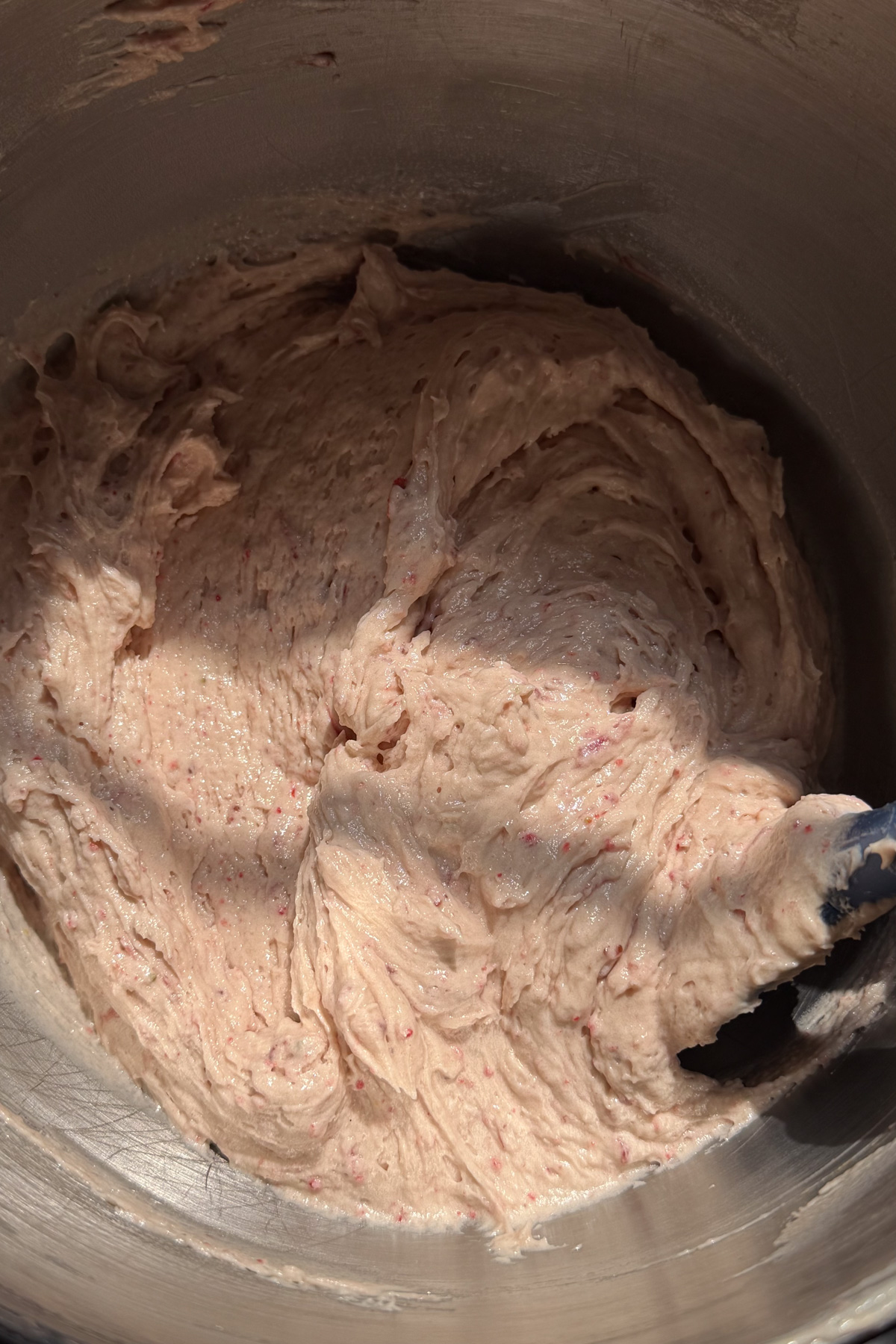 Strawberry crunch cupcake batter in a mixing bowl.