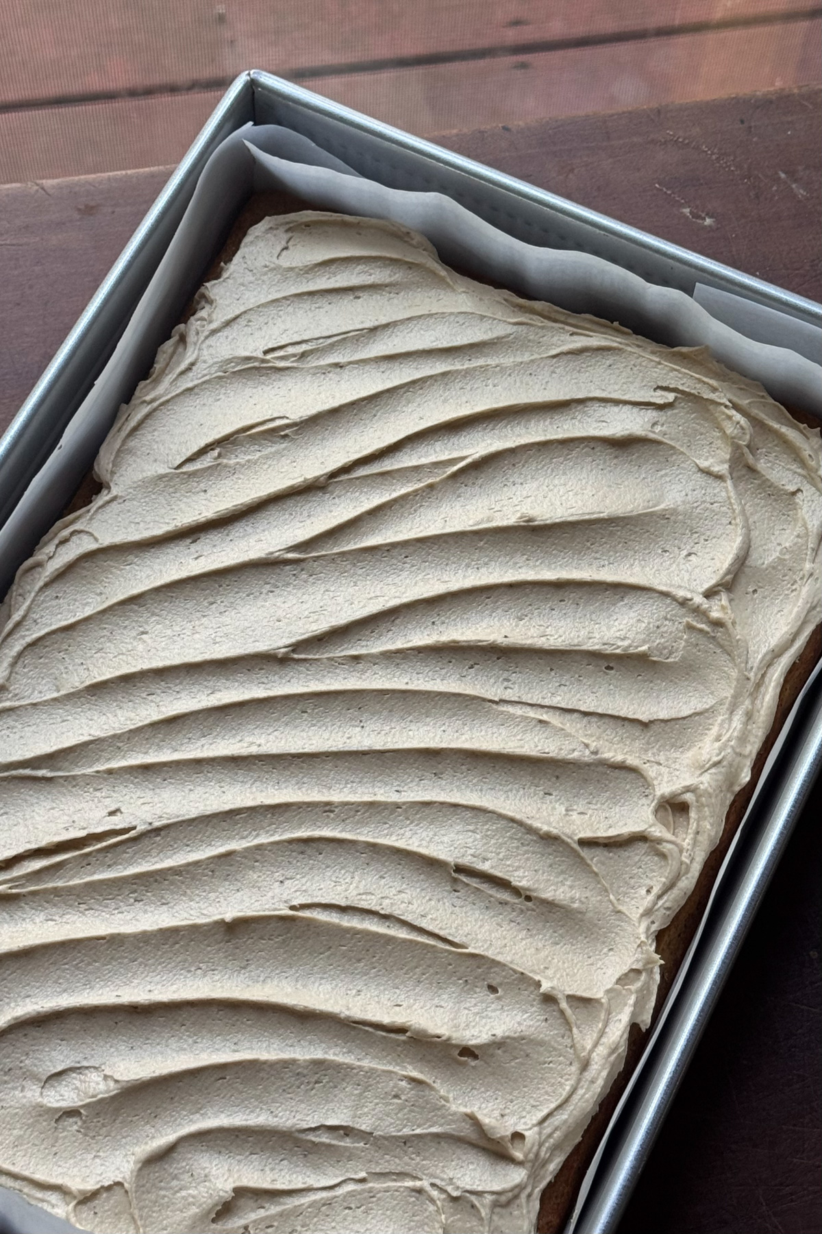 Picture of a prepared vanilla chai cake with espresso buttercream.