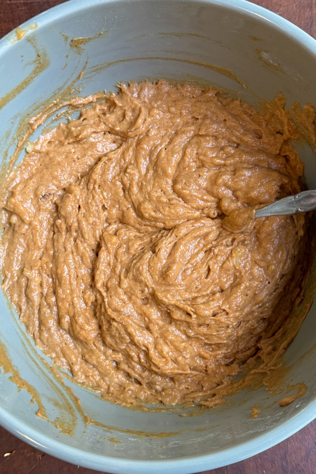Picture of sourdough pumpkin banana muffin batter in a mixing bowl.