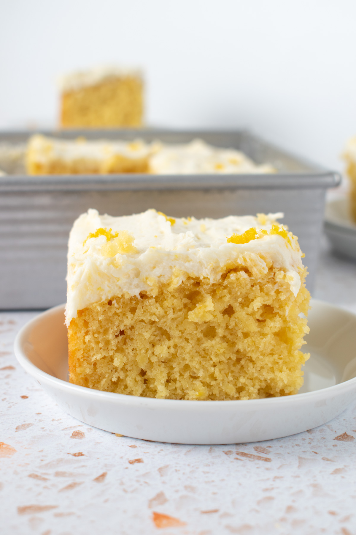 Picture of sourdough discard lemon snack cake on a plate.