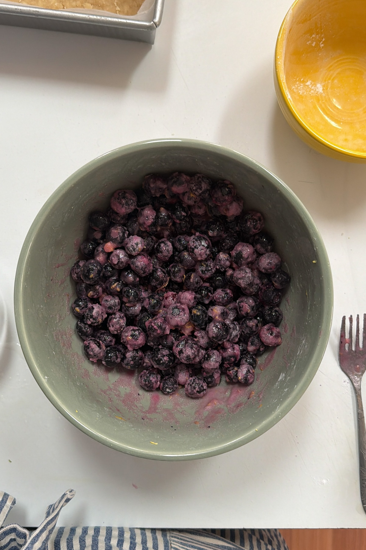 Picture of blueberry crumb bar filling in a ceramic mixing bowl.