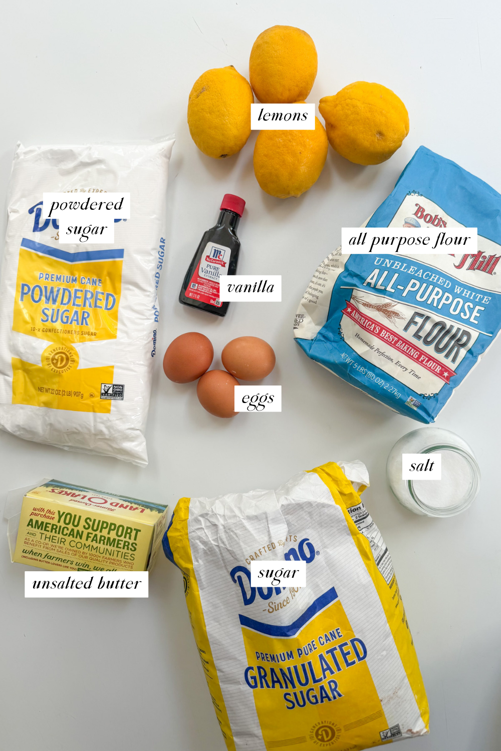 Overhead image of the ingredients needed for lemon crumb bars with ingredient labels.