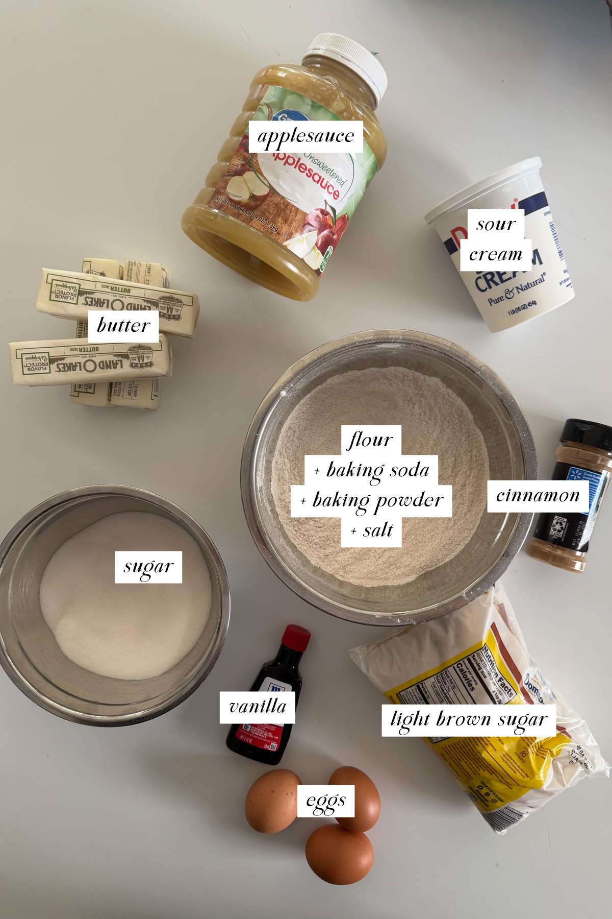 The ingredients needed for applesauce crumb cake with labels.