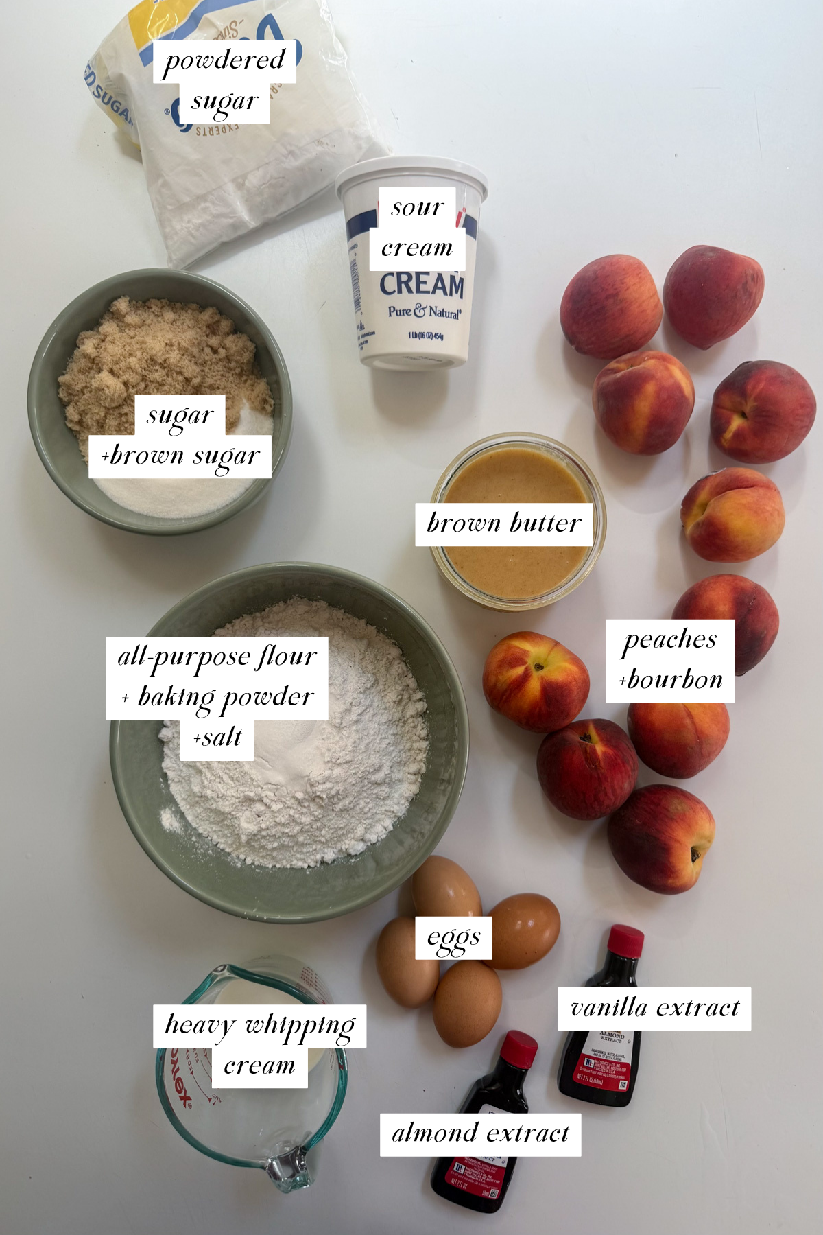 The ingredients needed for a brown butter bourbon peaches and cream cake with labels.