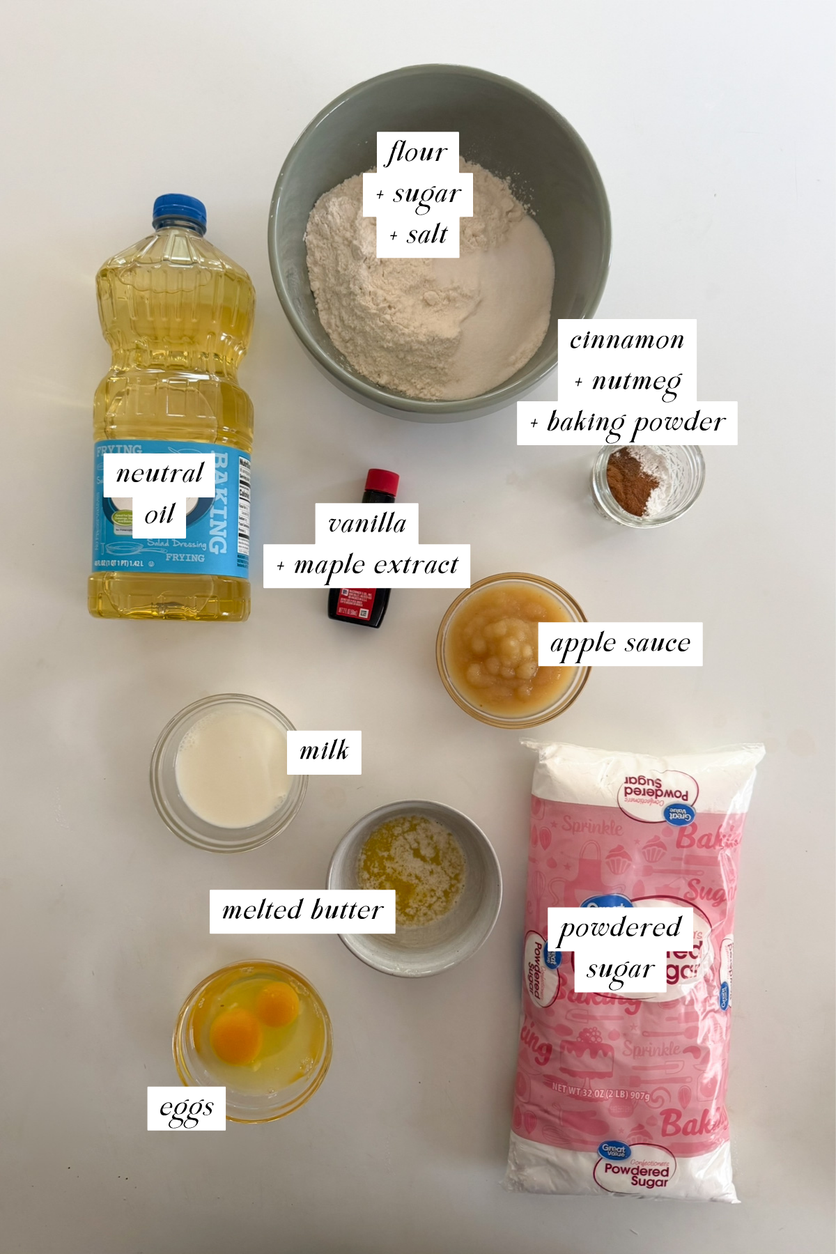 The ingredients needed for glazed applesauce fritters with labels. 